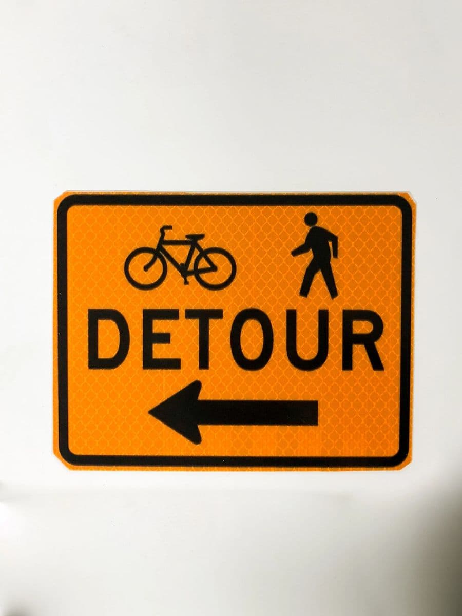 Orange bike and pedestrian Detour sign with arrow