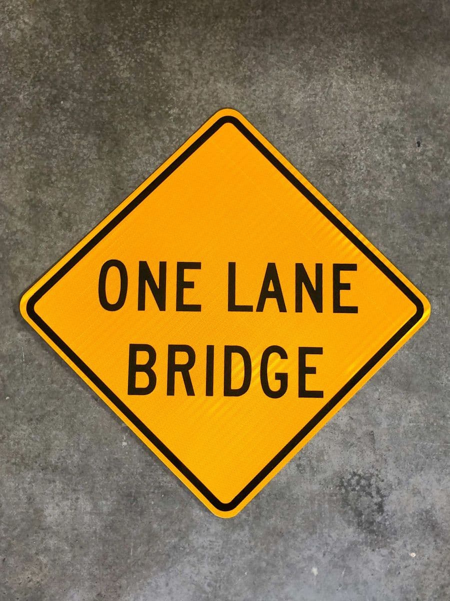 Yellow diamond One Lane Bridge warning sign