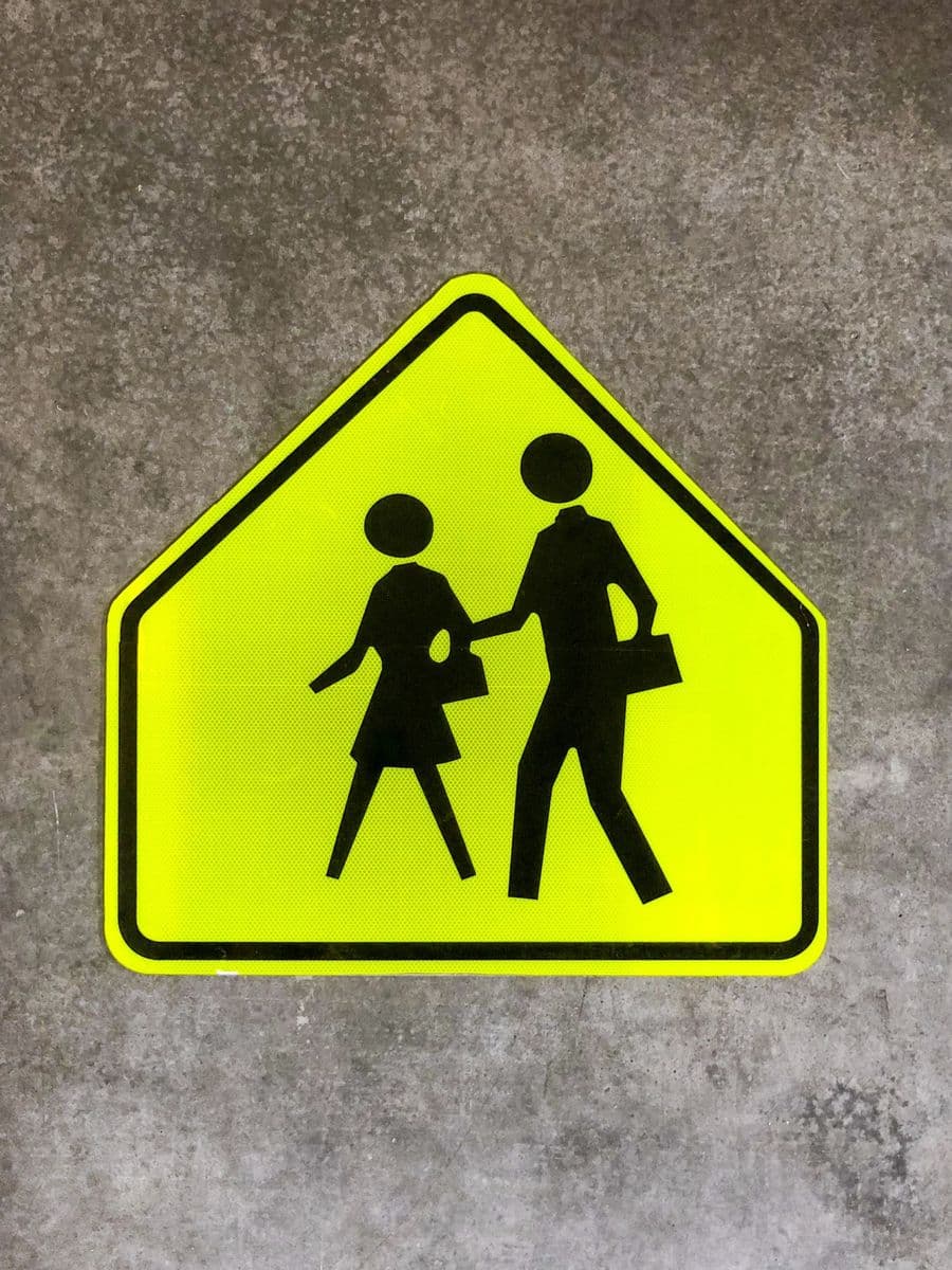 Fluorescent yellow-green school pedestrian crossing sign