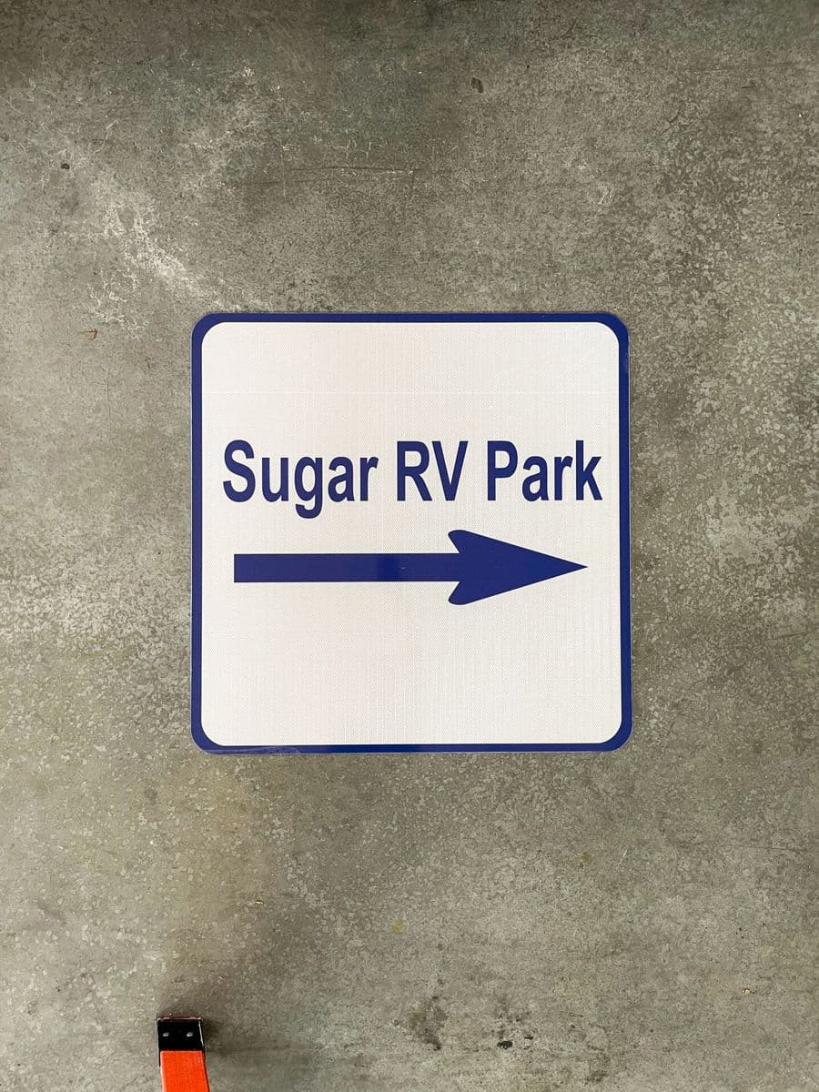 Sugar RV Park directional sign with arrow